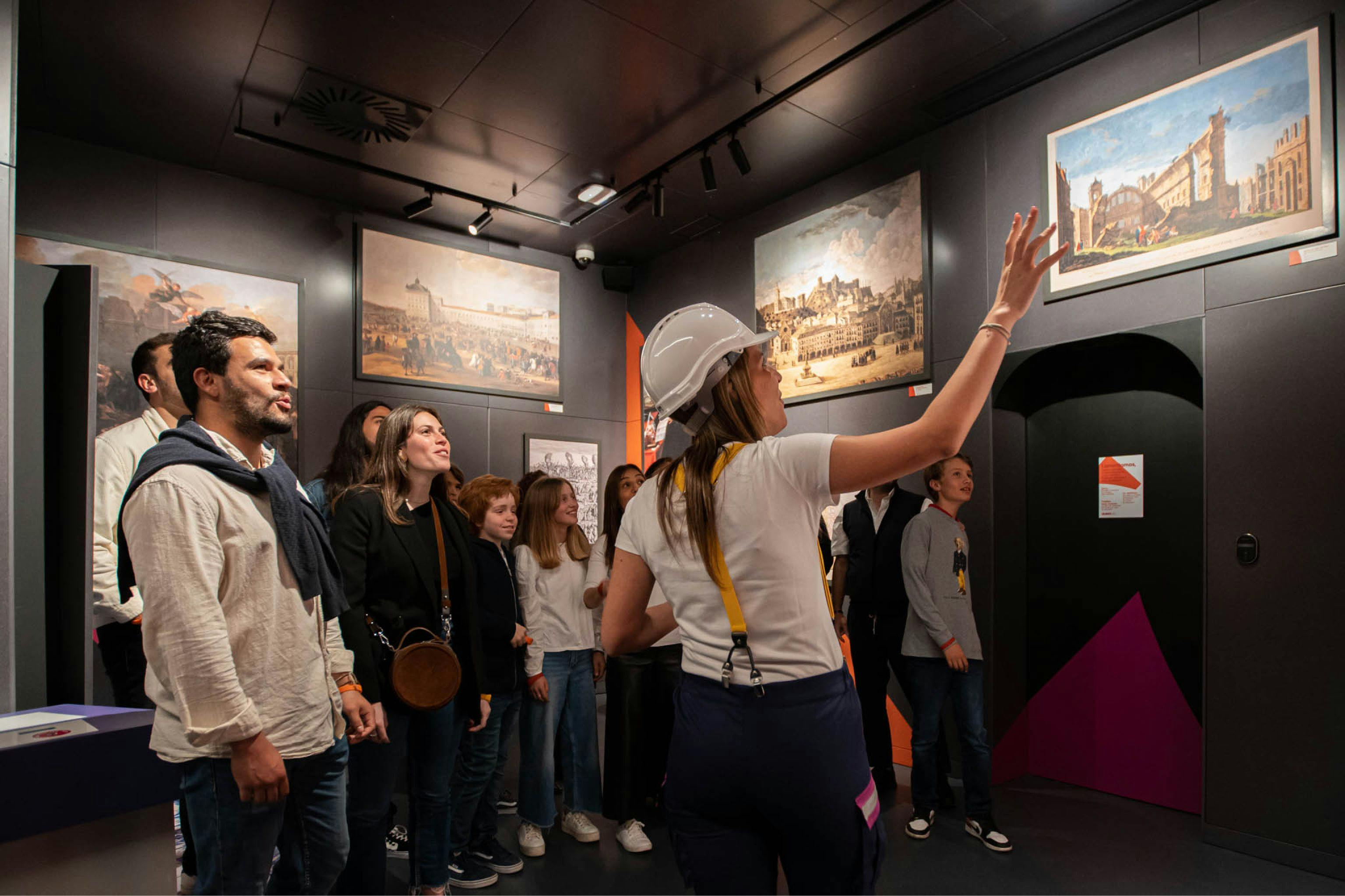 Group of people listening to the introduction of the Quake's museum visit